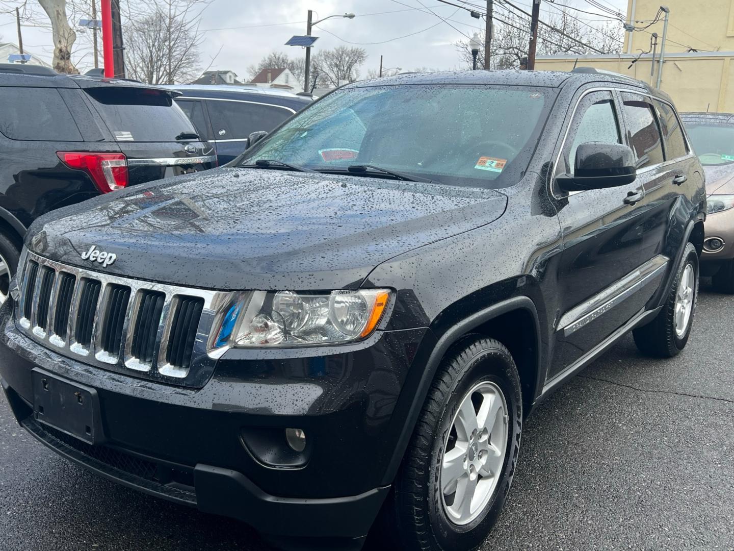 2013 BLACK /beige Jeep Grand Cherokee Laredo 4wd (1C4RJFAG4DC) with an 3.6L V6 DOHC 24V GAS engine, 5 Speed Automatic transmission, located at 1018 Brunswick Ave, Trenton, NJ, 08638, (609) 989-0900, 40.240086, -74.748085 - Photo#0